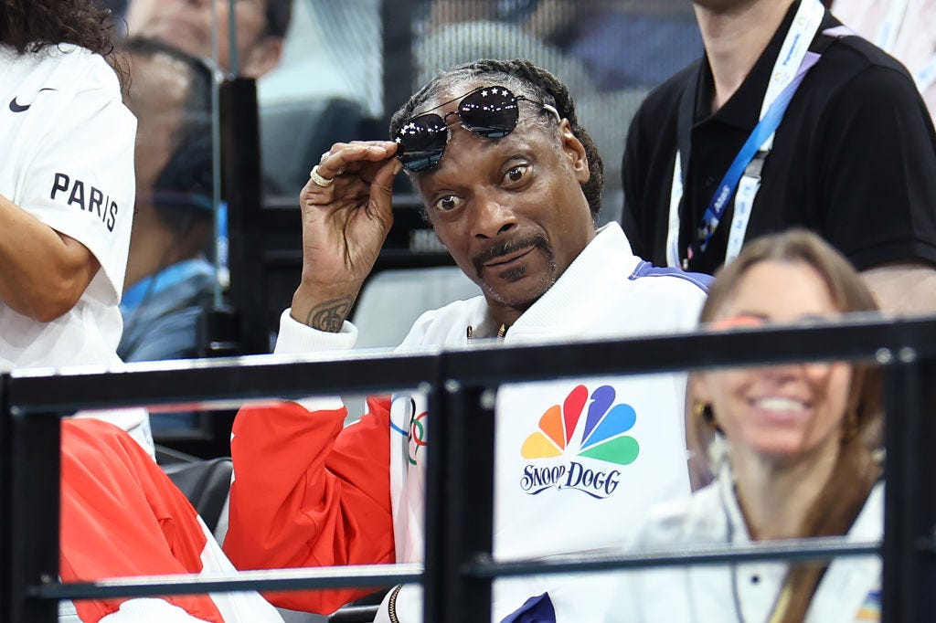 Snoop Dogg (R) attends the Artistic Gymnastics Women's Qualification on day two of the Olympic Games Paris 2024 at Bercy Arena on July 28, 2024 in Paris, France.