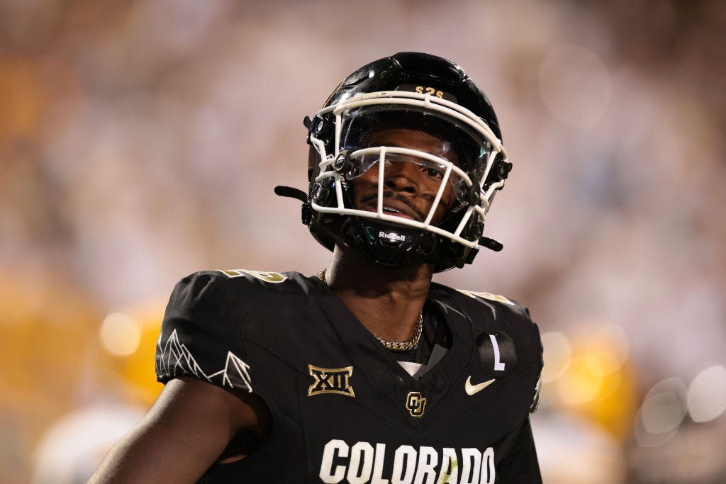 Shedeur Sanders #2 of the Colorado Buffaloes celebrates after throwing his 100th career touchdown during the third quarter against the North Dakota State Bison at Folsom Field on August 29, 2024 in Boulder, Colorado. (Photo by Andrew Wevers/Getty Images)