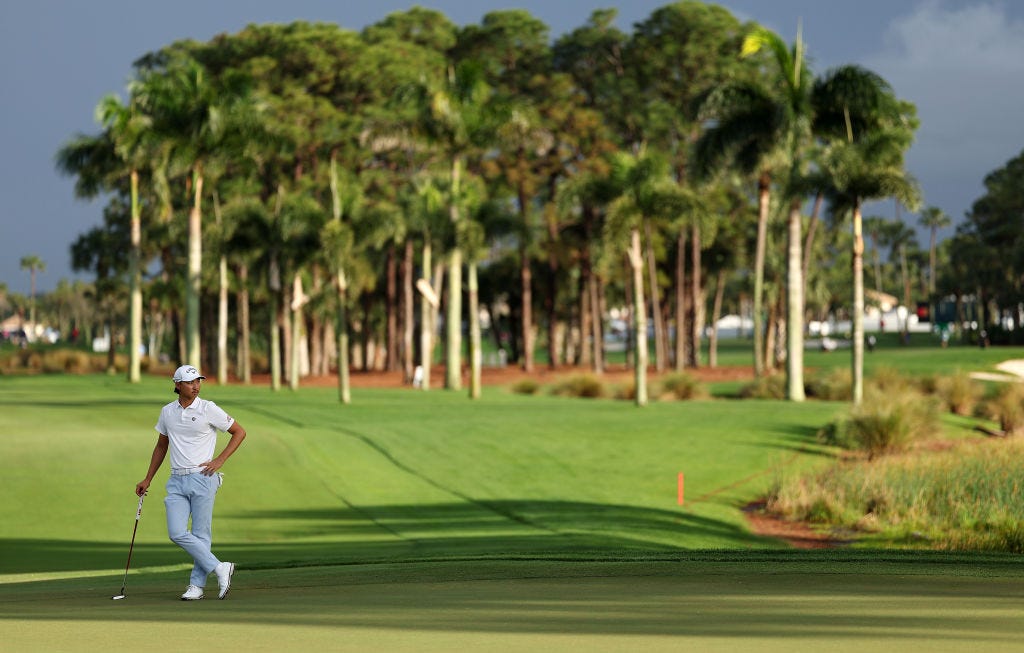 Min Woo Lee of Australia lines up a putt on the second hole during the final round of The Cognizant Classic in The Palm Beaches at PGA National Resort And Spa on March 03, 2024 in Palm Beach Gardens, Florida. 