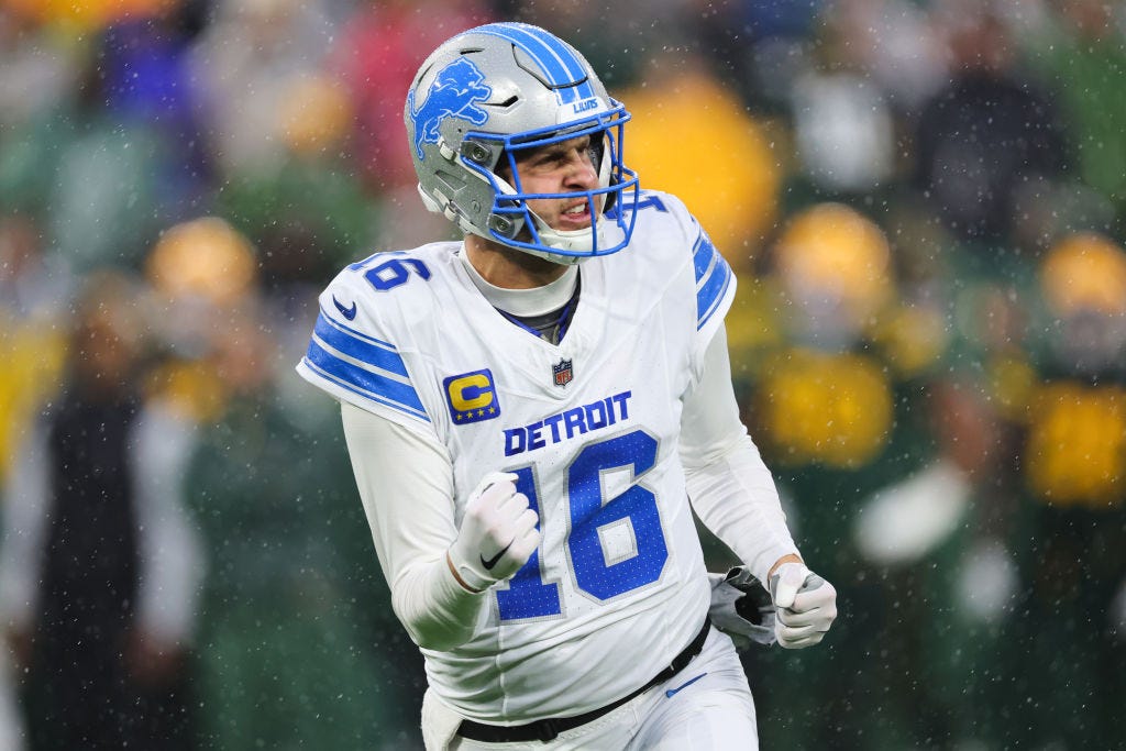 Quarterback Jared Goff #16 of the Detroit Lions reacts after throwing a second quarter touchdown pass against the Green Bay Packers at Lambeau Field on November 03, 2024 in Green Bay, Wisconsin. 